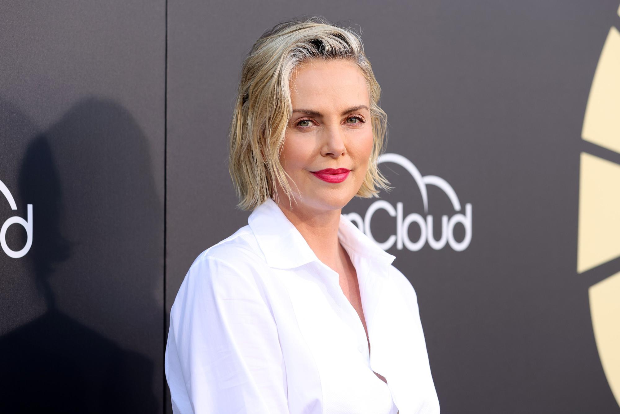 Charlize Theron Celebrates Her 46th Birthday With An 80s Prom Murder Mystery Party Yahoo